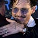 Actor Johnny Depp, with a diamond ring on his left hand, attends a promotional event for his new movie &#xec;Transcendence&#xee; in Beijing, China, Mo