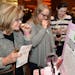 Linda Madden (from left), Susan George ad Eimile Campbell sniff various scents at Aromi' s shop at Maiden Minnesota 2014.
