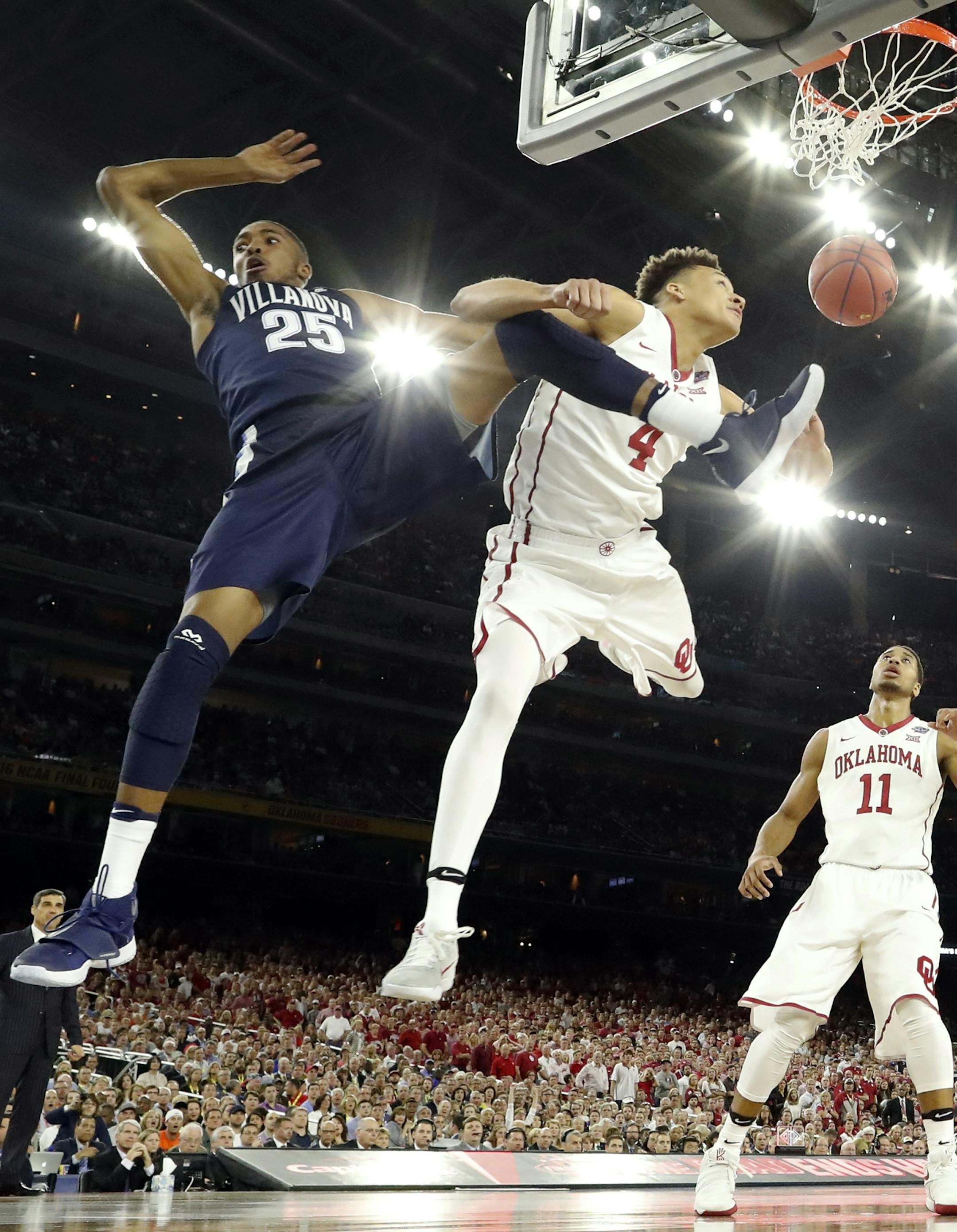 Villanova's Mikal Bridges (25) dunks as he is fouled by Oklahoma's Jamuni McNeace (4) during the second half of the NCAA Final Four tournament college basketball semifinal game Saturday, April 2, 2016, in Houston. (AP Photo/David J. Phillip)