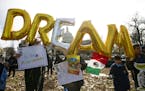Demonstrators hold up balloons during an immigration rally in support of the Deferred Action for Childhood Arrivals (DACA), and Temporary Protected St