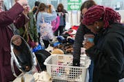 People look for good finds at Edina's 2023 Community Clothing Swap. The city is hosting a jewelry and accessories swap this month.