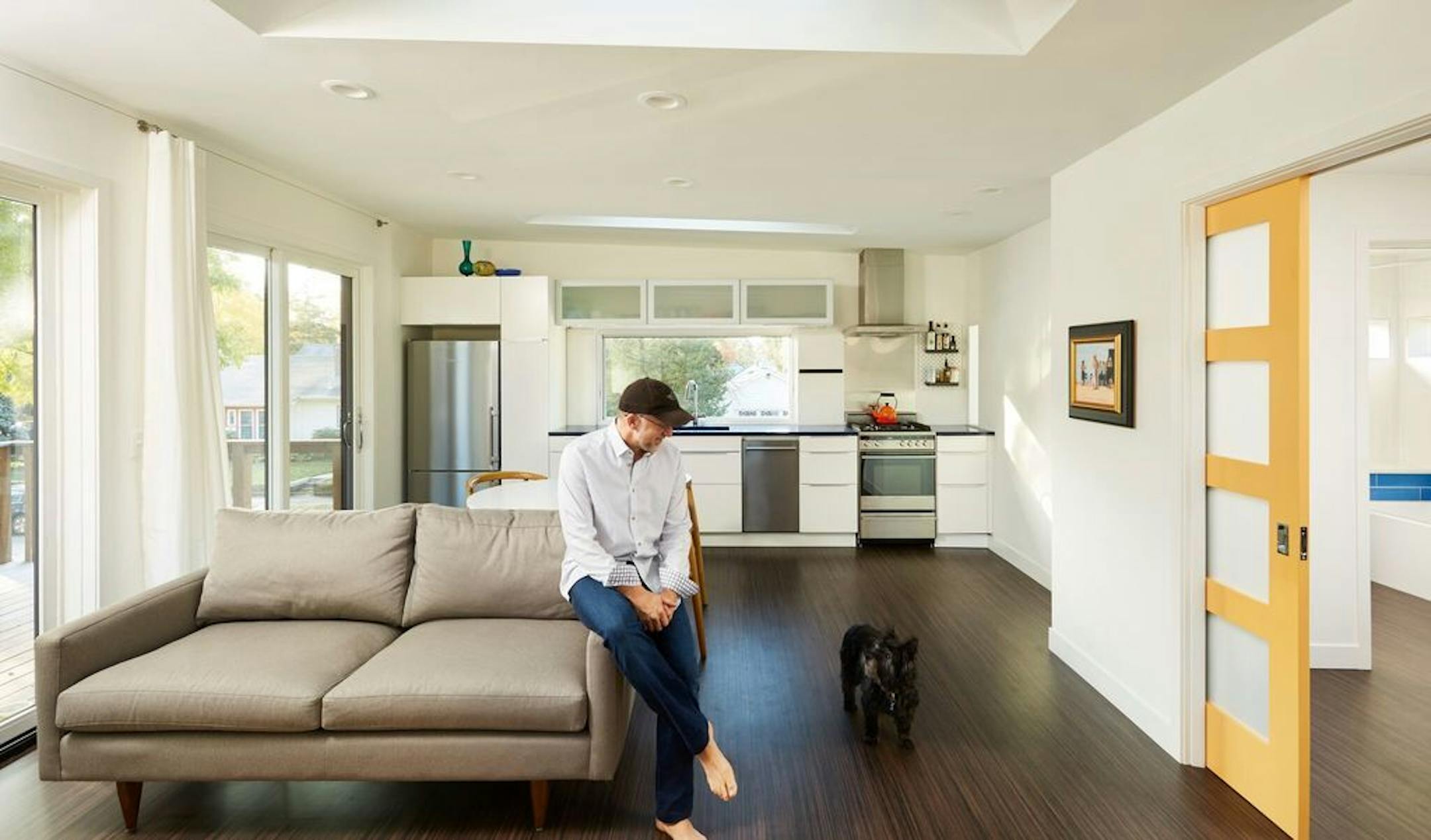Chris Iverson, pictured with his dog, Ruby, built a small house (accessory dwelling unit) in the backyard of a duplex he owns in Minneapolis.