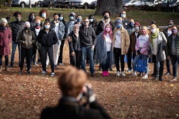 U.S. Rep Ilhan Omar staffers and volunteers posed for a group photo in Powderhorn Park before the split into teams to door knock around the neighborho