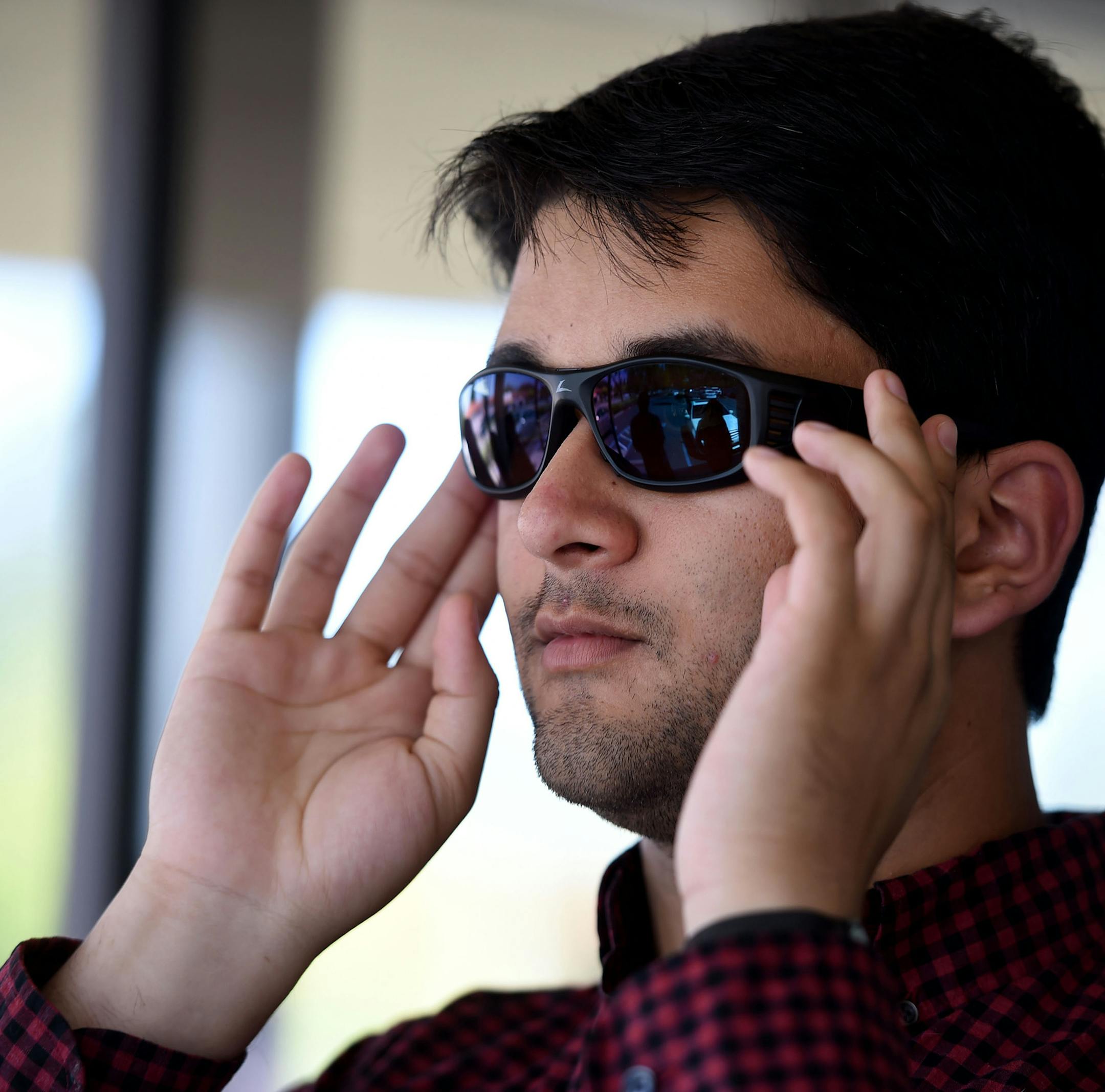 Farhan Sareshwala, who is colorblind, tried on a pair of EnChroma glasses that are made to improve color vision.