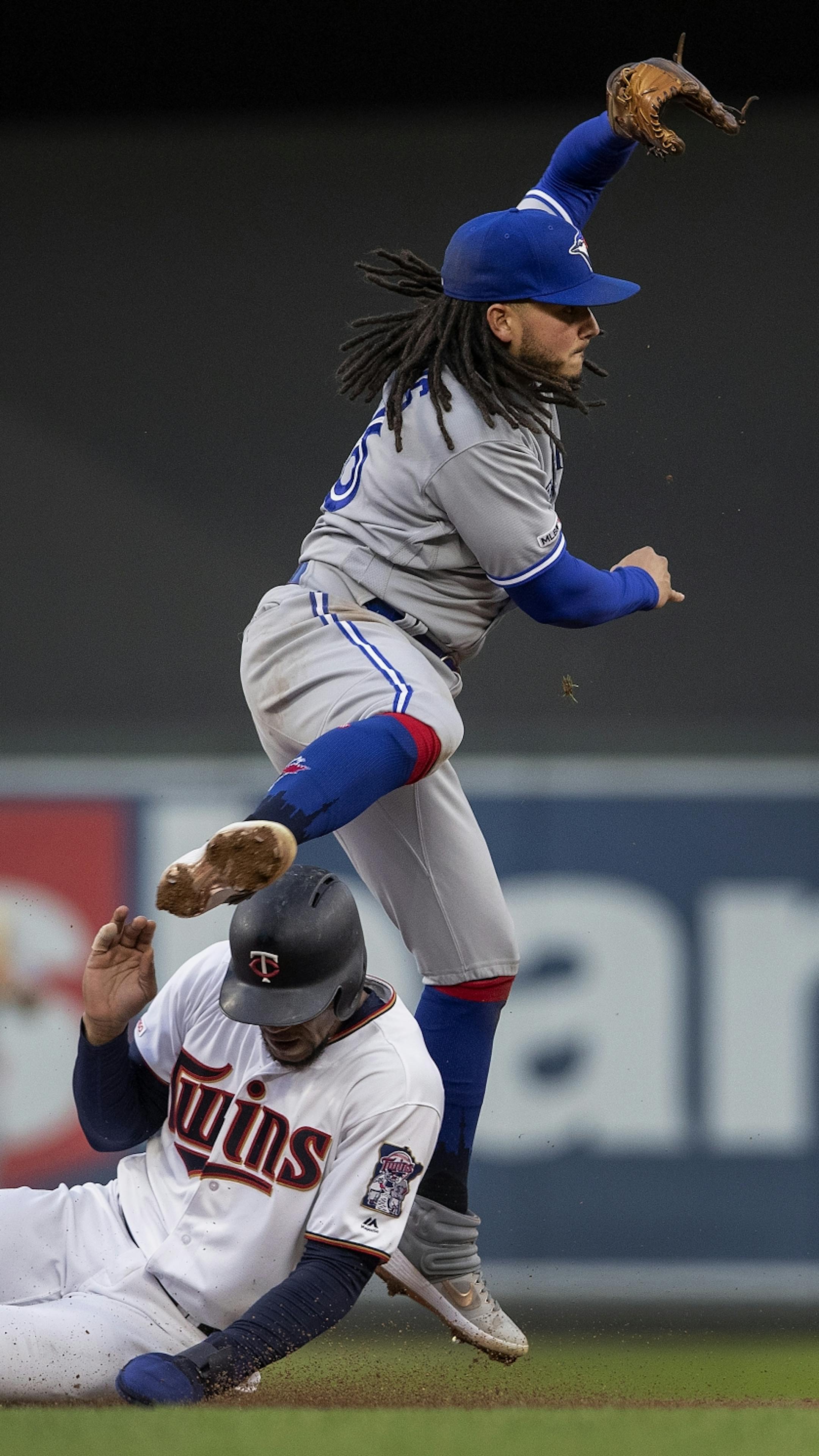 Freddy Galvis hurdled Byron Buxton while turning a double play in the third inning.