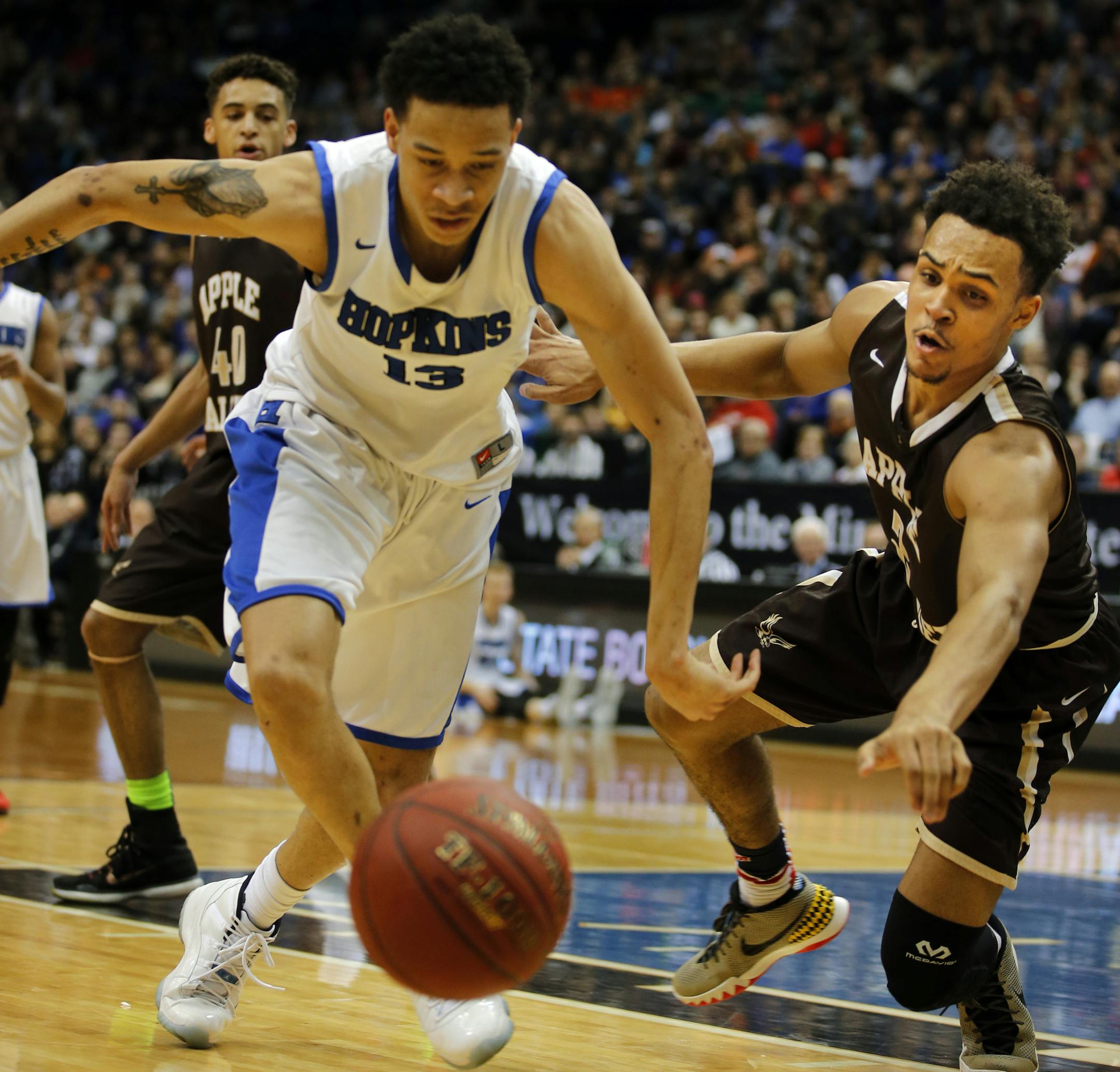 Amir Coffey(13) and Gary Trent Jr.(2) fight for a loose ball.] At Target Center in 4A quarterfinal boys basketball game between Apple Valley and Hopkins. Richard Tsong-Taatarii/rtsong-taatarii@startribune.com