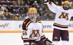 Minnesota Gophers forward Sampo Ranta (58) celebrated his second period goal with forward Ben Meyers (39), right, against the Michigan State Spartans.