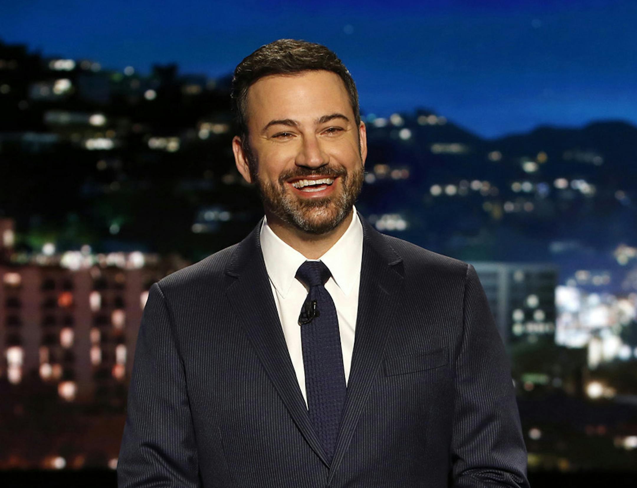 In this April 11, 2017 photo, host Jimmy Kimmel appears during a taping of "Jimmy Kimmel Live," in Los Angeles. Kimmel says his newborn son is home and doing great after open-heart surgery. A tearful Kimmel turned his show's monologue Monday, May 1, into an emotional recounting of the crisis with what Kimmel called a "happy ending." (Randy Holmes/ABC via AP)