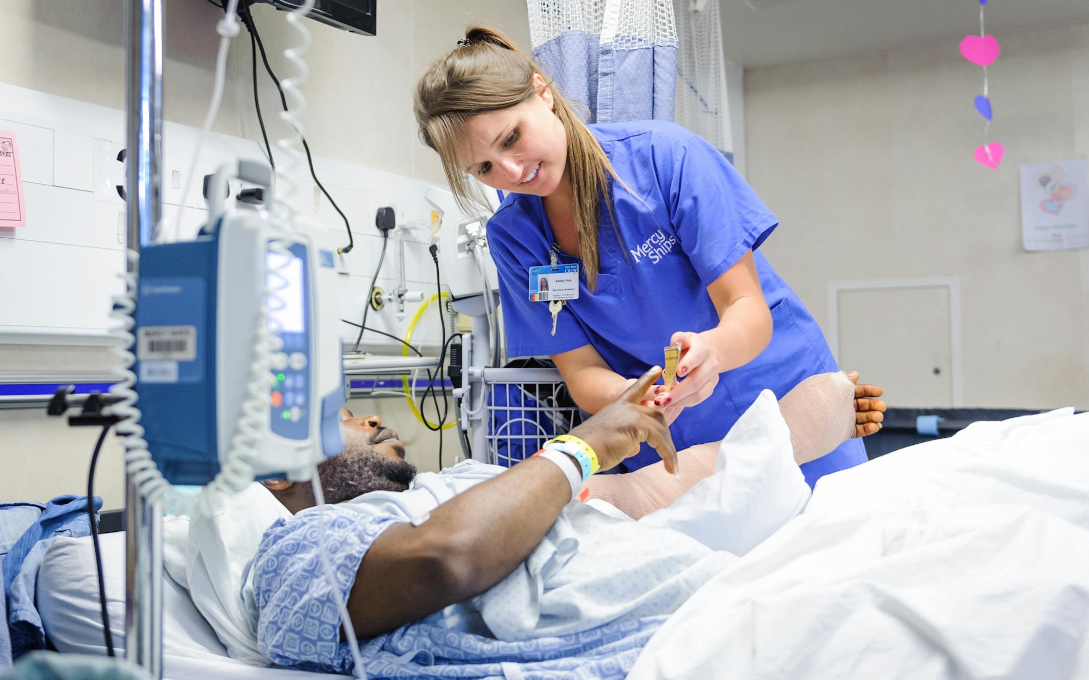 Ward nurse Ashley Vick at work. Ashley Vick, of Lakeville, assisted a patient at Mercy Ships docked in Cameroon last week. Photo Courtesy of Mercy Ships, Saul Loubassa Bighonda