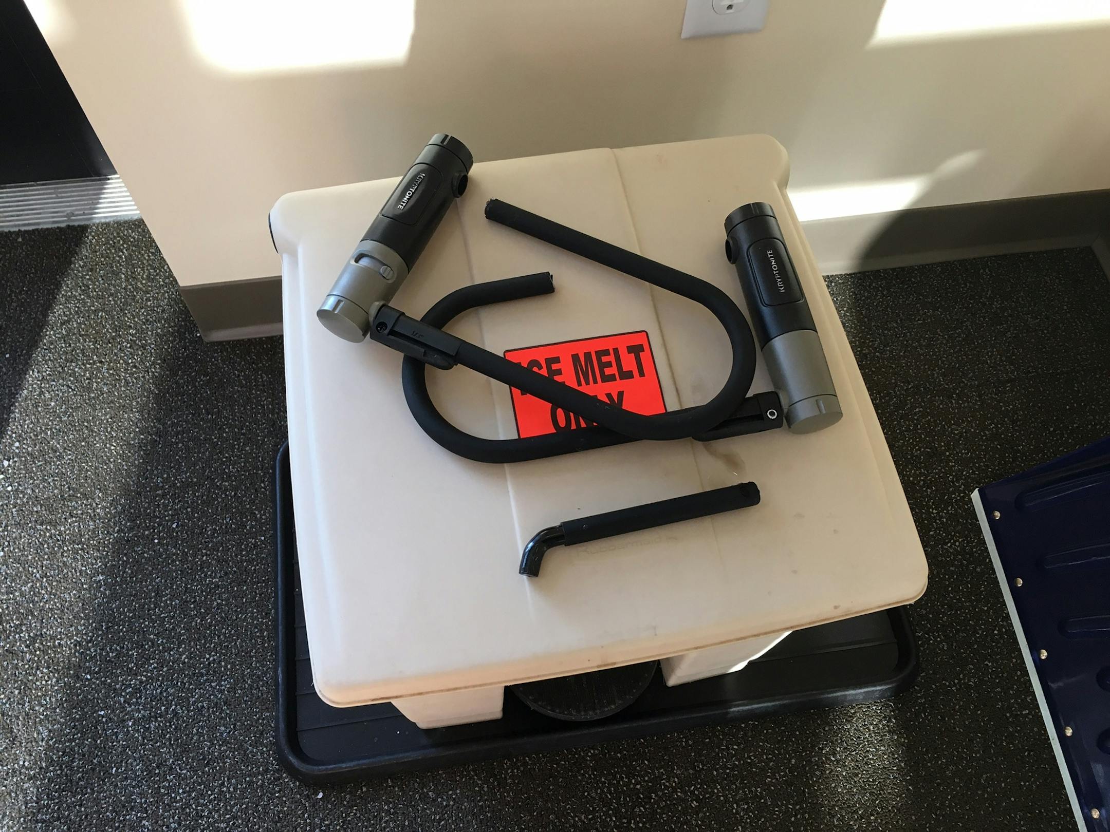 Minneapolis firefighters cut these bicycle locks from the doors of an Uptown Wells Fargo branch after Dakota Access Pipeline protesters placed them on two of three doors.