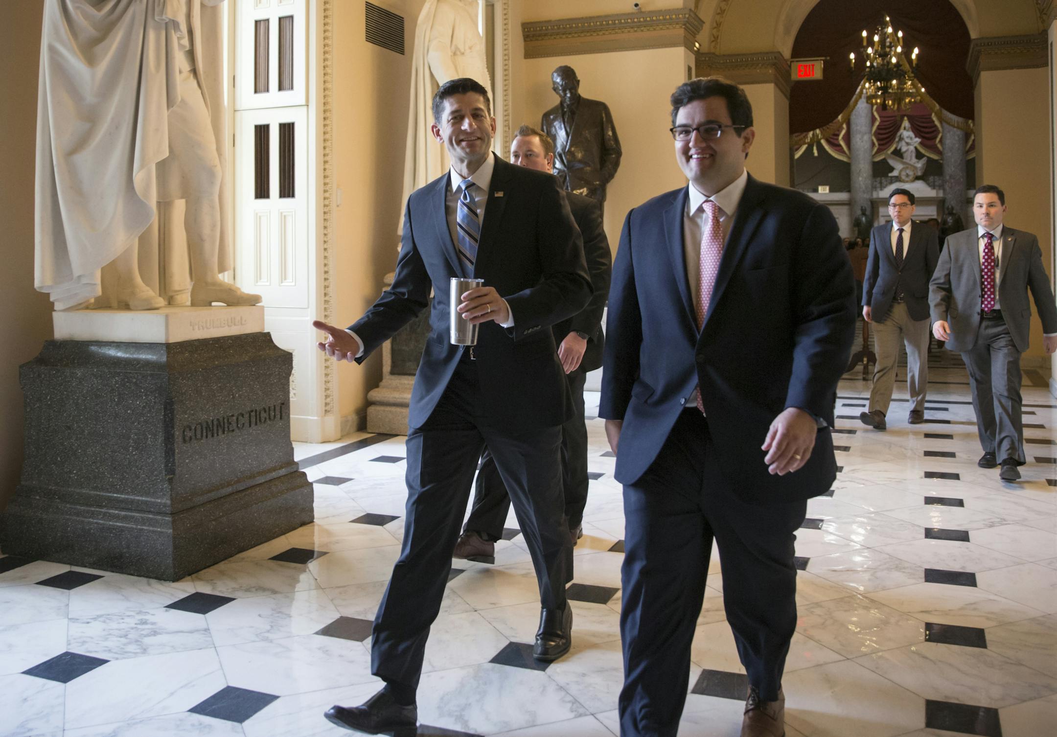House Speaker Paul Ryan of Wis., center, walks to the House chamber on Capitol Hill in Washington, Friday, Feb. 12, 2016, as Republicans and Democrats joined together to overwhelmingly approve legislation that hits North Korea with more stringent sanctions for refusing to stop its nuclear weapons program. (AP Photo/J. Scott Applewhite)