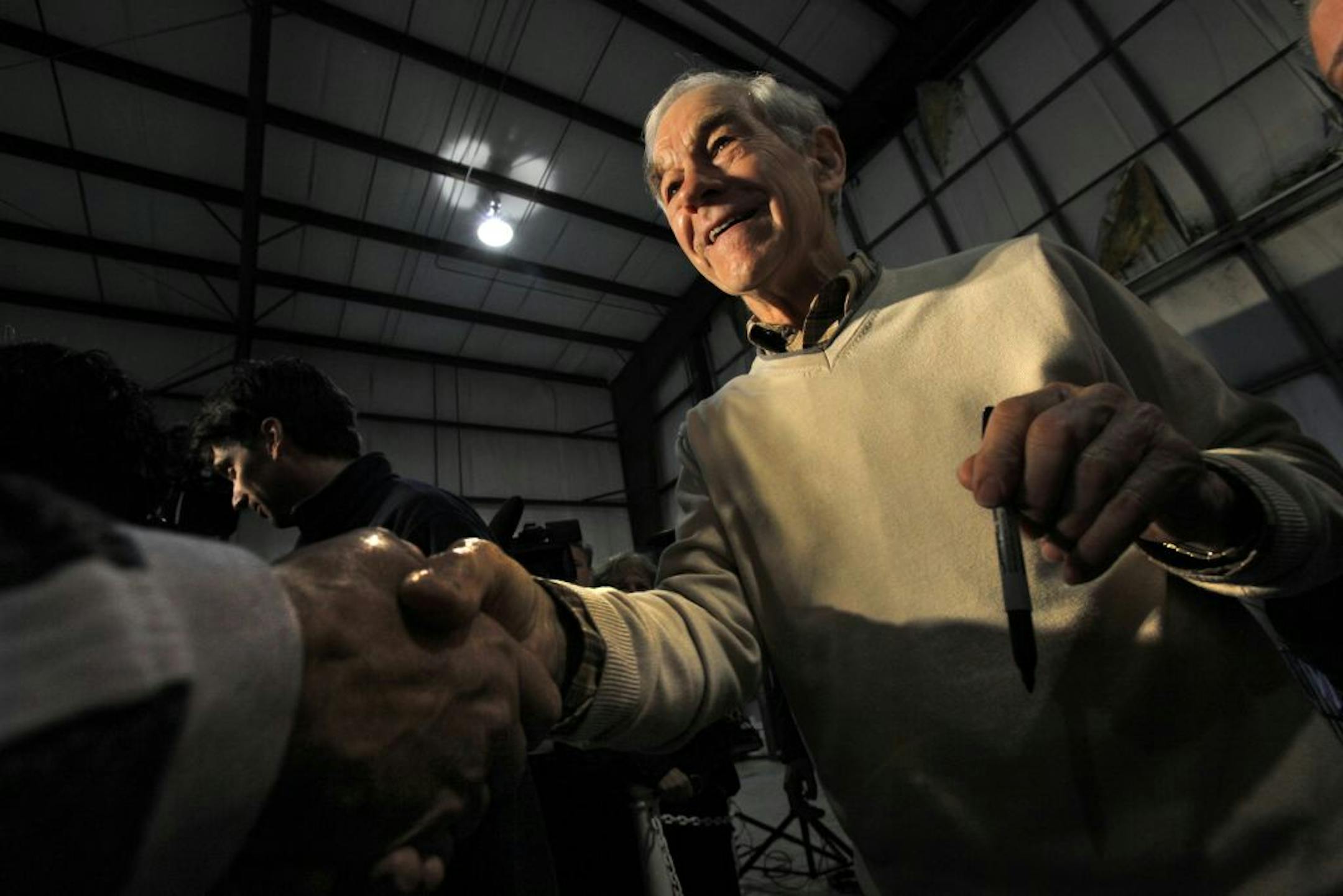 Republican presidential candidate, Rep. Ron Paul, R-Texas greets supporters and signs autographs during a whistle-stop tour at the Grand Strand Airport in North Myrtle Beach, S.C. on Friday Jan. 20, 2012.