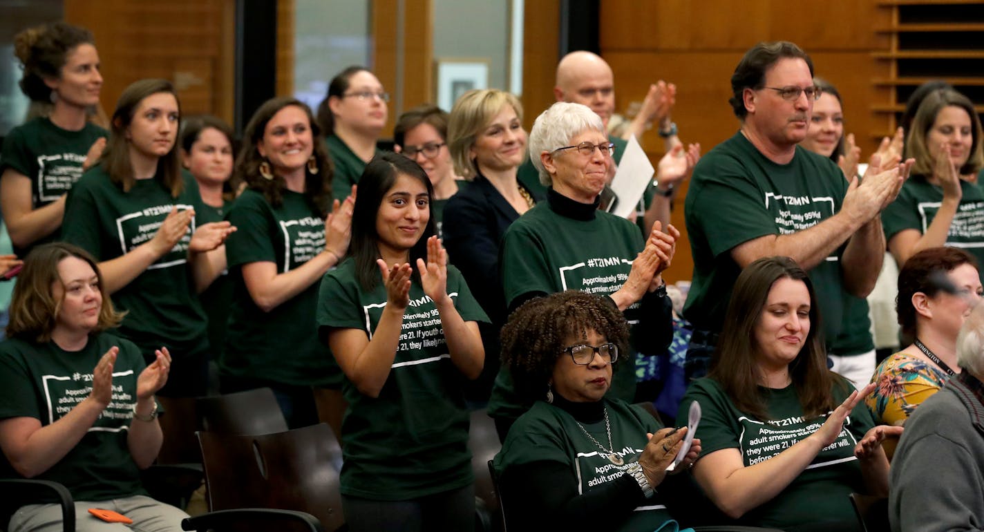 Supporters wearing green shirts applauded after the amending of Tobacco sales in Edina from a minimum age of 18 to 21. ] CARLOS GONZALEZ � cgonzalez@startribune.com - May 2, 2017, Edina, MN, Edina is expected to vote to raise the age of tobacco sales in the city from 18 to 21 at tonight's City Council meeting.