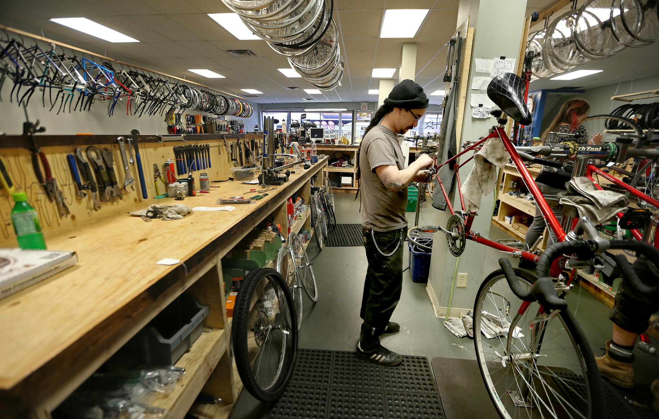 Gil Rojas-Spice of Recovery Bike Shop worked on bikes, Monday, December 2, 2013 in Minneapolis, MN. The shop is part of a new co-op development. (ELIZABETH FLORES/STAR TRIBUNE) ELIZABETH FLORES • eflores@startribune.com