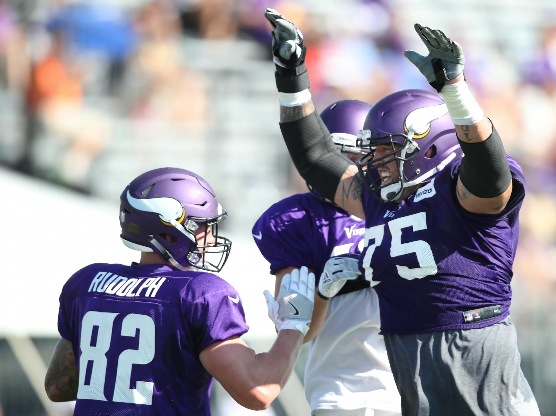 Minnesota Vikings tight end Kyle Rudolph (82) left celebrated a catch with offensive guard Alex Boone (75) during practice at Minnesota State University Mankato Saturday July 29, 2017 in Mankato , MN.