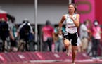 Krystsina Tsimanouskaya, of Belarus, runs in the women’s 100-meter run at the Olympics on July 30.