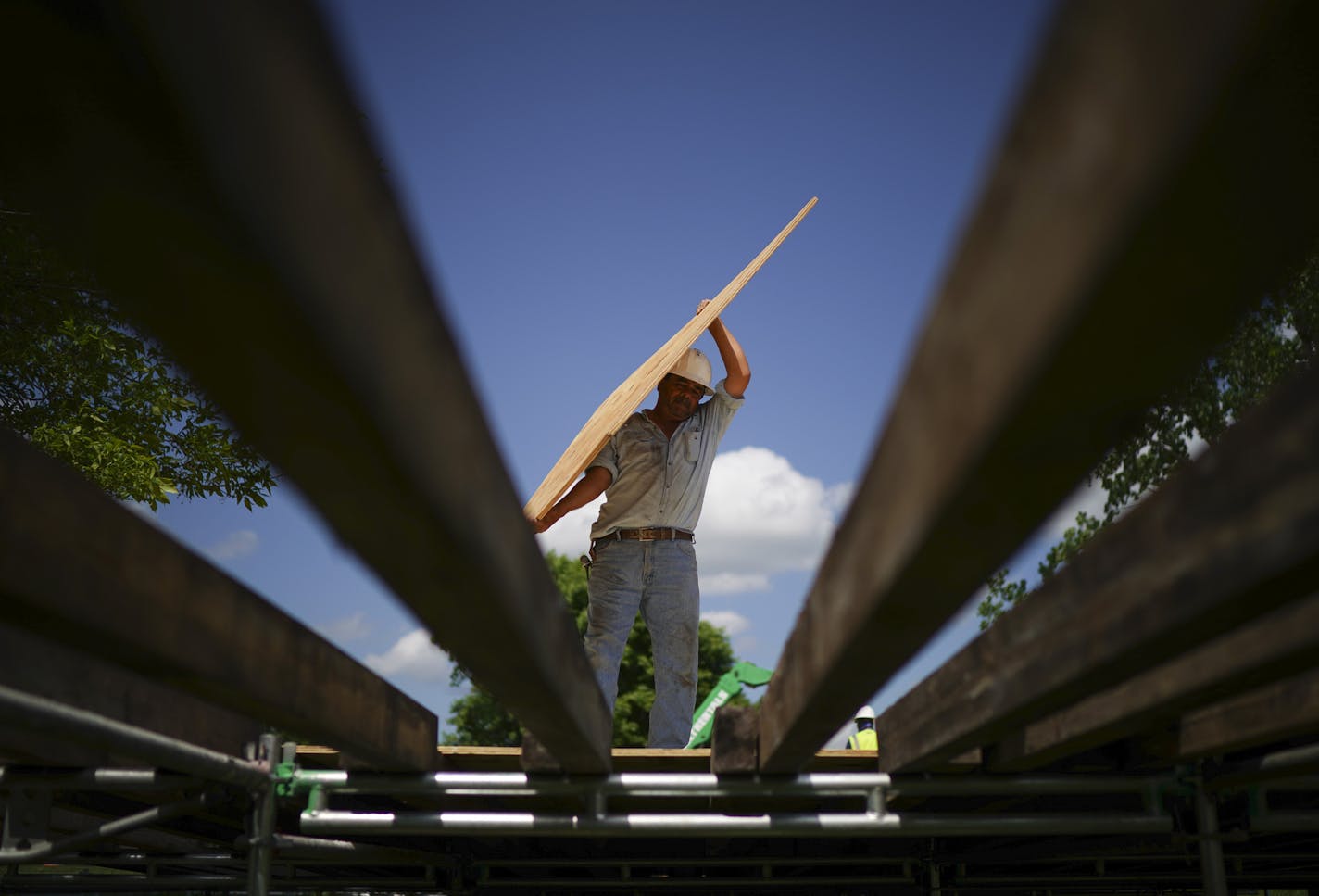 Workers built a walkway at the main entrance to TPC Twin Cities golf course in Blaine on June 6. Thousands pour will into the Anoka County suburb come July for the inaugural 3M Open, Minnesota's first regular PGA Tour stop in 50 years.