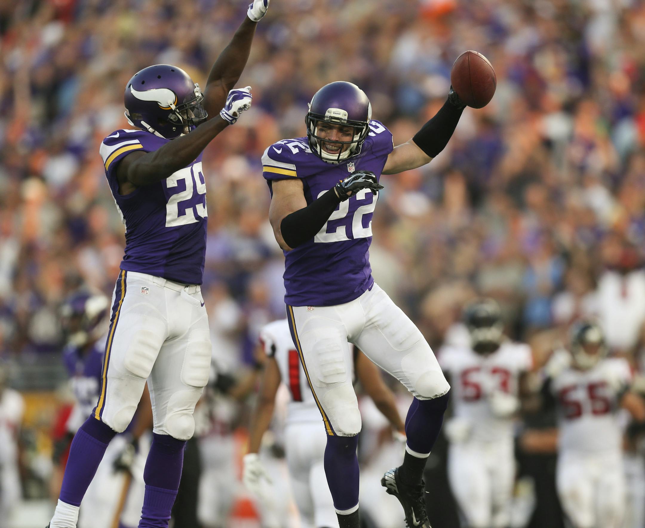 Minnesota Vikings free safety Harrison Smith (22) celebrated an interception with Xavier Rhodes in 2014.