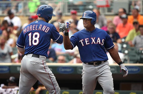 Rangers� Adrian Beltre (right) and Mitch Moreland celebrated after Moreland�s two-run home run in the fourth inning.
