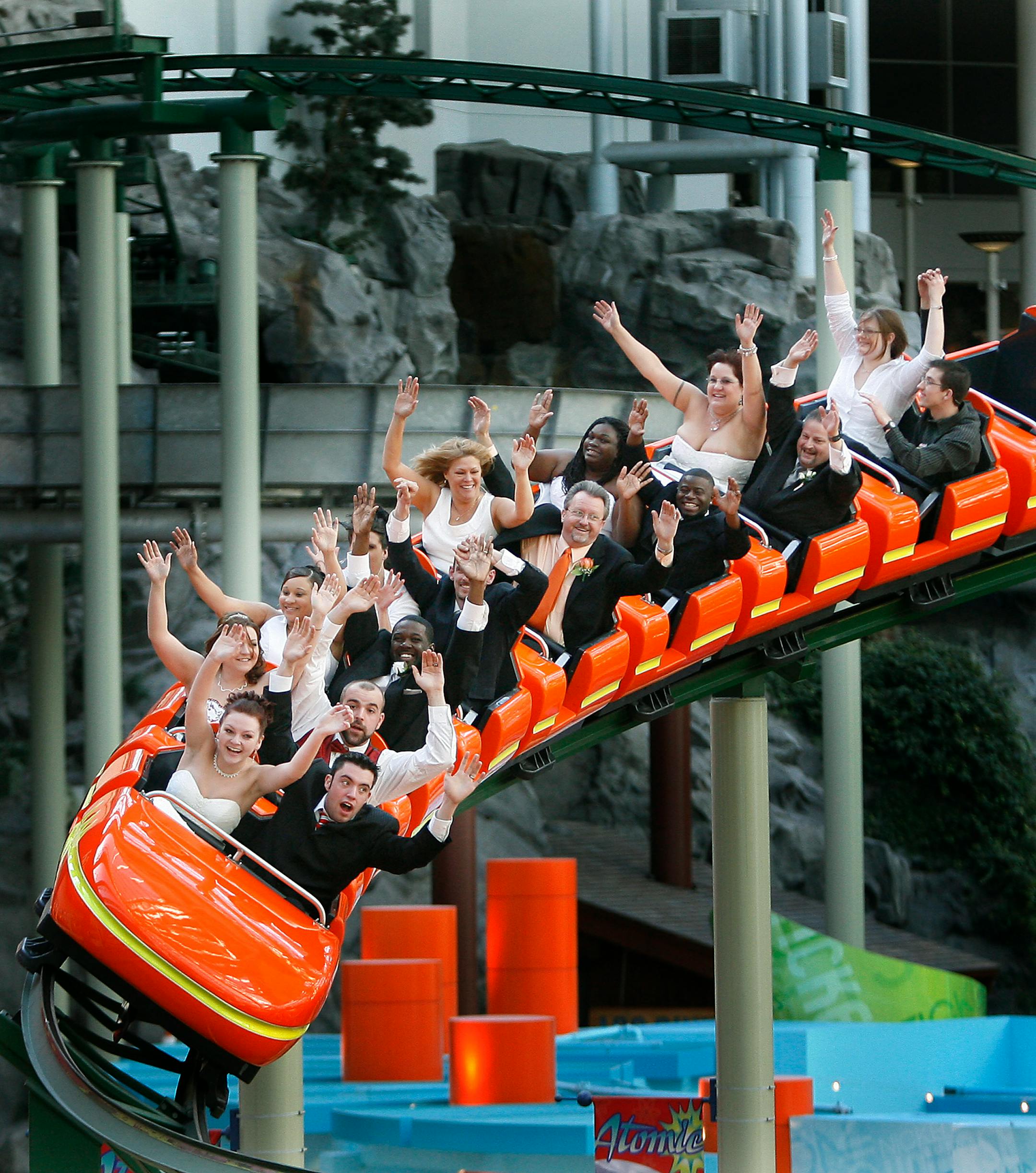ELIZABETH FLORES• eflores@startribune.com April 15, 2009 - Bloomington, MN - Fifteen adventure-seeking couples rode on the Pepsi Orange Streak roller coaster after they exchanged wedding vows on the roller coaster at the Mall of America in the Nickelodeon Universe theme park. The Chapel of Love celebraed 15 years by offering a free roller coaster wedding ceremony for the couples. The couples also received free toasting glasses, a botle of champagne, a DVD of the ceremony and a couple won a round-trip honeymoon to CanCun, Mexico and a $1000 shopping spree at the Mall of America.