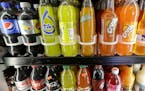 FILE - In this Wednesday, Sept. 21, 2016, file photo, soft drink and soda bottles are displayed in a refrigerator at El Ahorro market in San Francisco