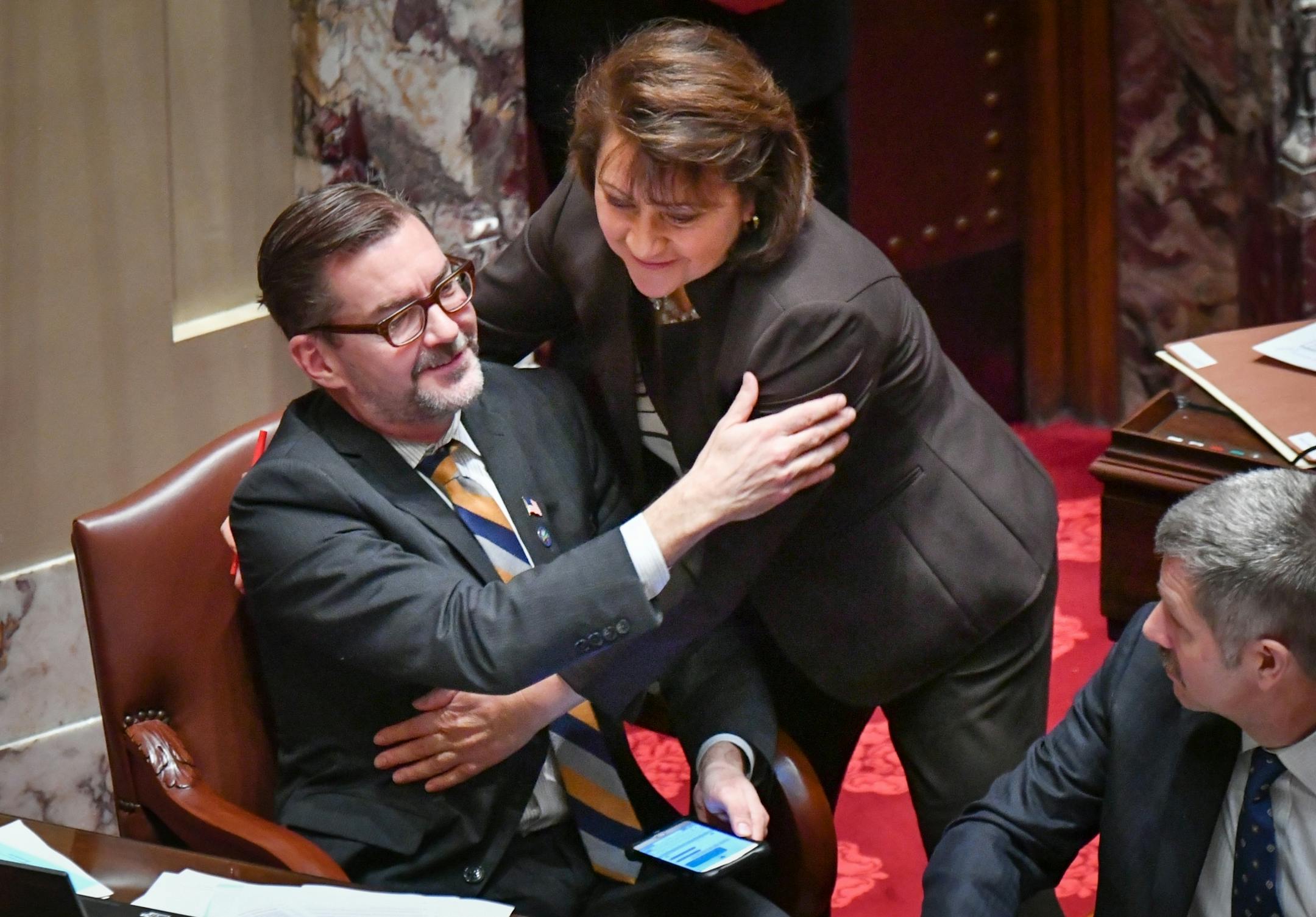 Senator Scott Dibble, DFL- Minneapolis got a hug from Senator Patricia Torres Ray, DFL-Minneapolis as Real ID bill voted down 29-38 with no DFL votes and five Republicans voting against it.