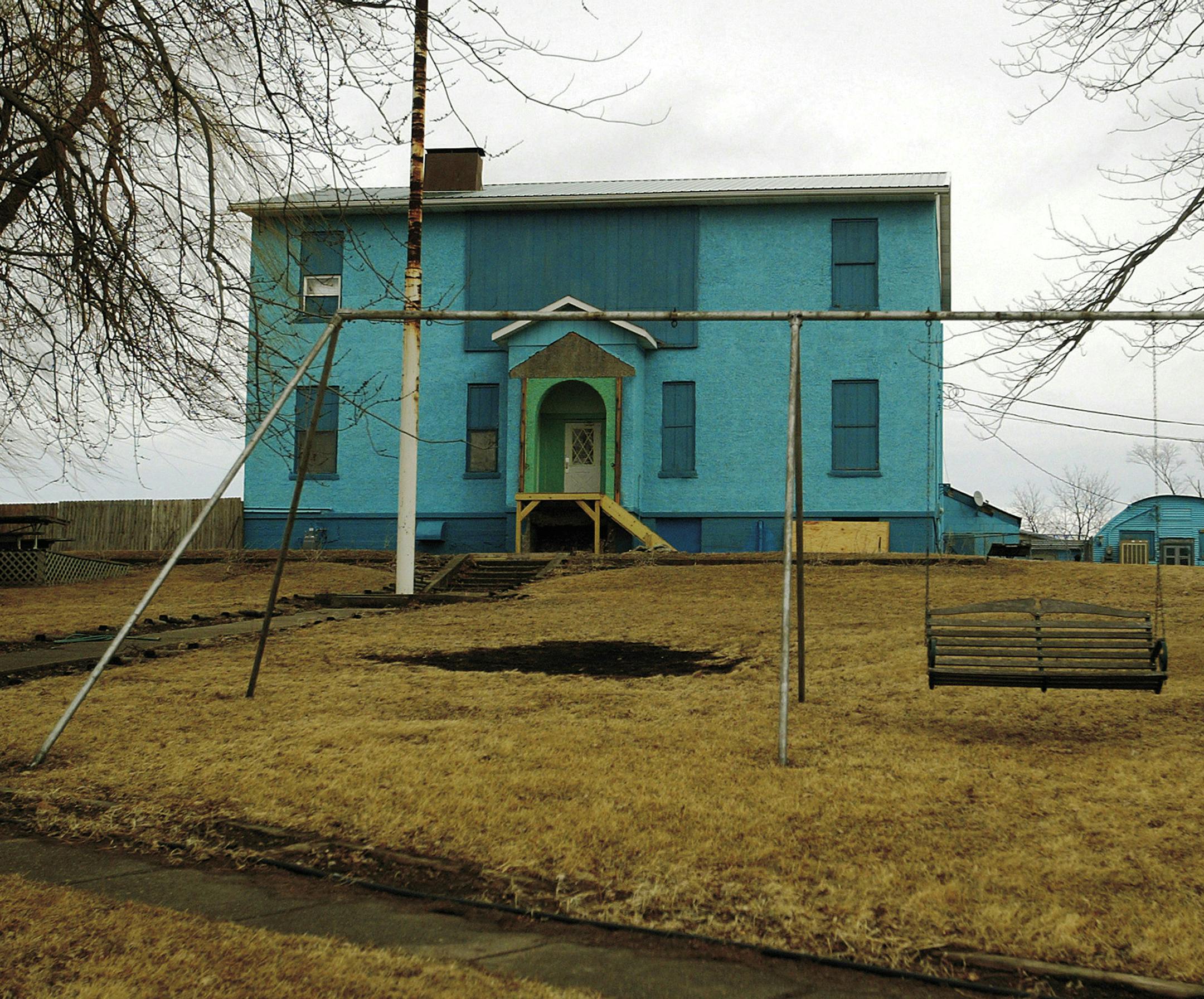 This 2009 photo shows the former school and Quonset hut in Atalissa, Iowa, that housed 21 mentally disabled men while they worked at West Liberty Foods until the state of Iowa closed down the facility. The men's employer, Henry's Turkey Farm, also served as their landlord and representative payee, collecting their Social Security disability benefits. The scandal showed a lack of oversight that enables some rep payees to exploit vulnerable adults for years. (AP Photo/The Quad City Times, John Sch