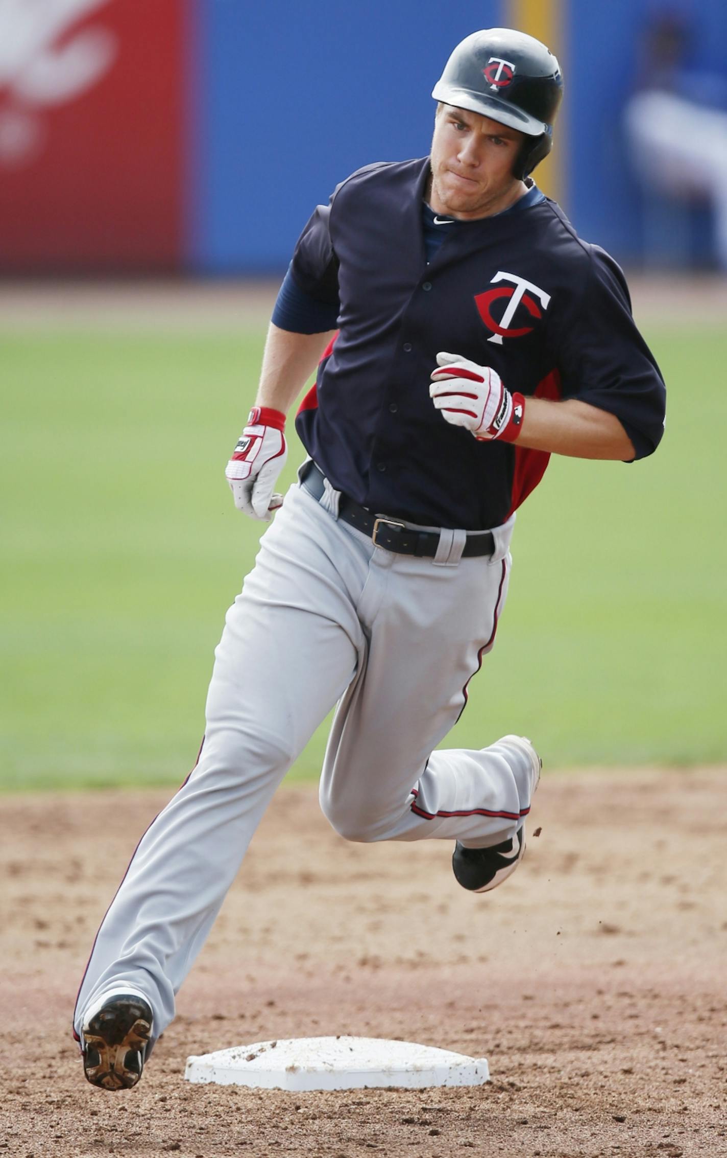 Joe Benson, who is competing for a job in center field, rounded second base after hitting a two-run home run on Tuesday.