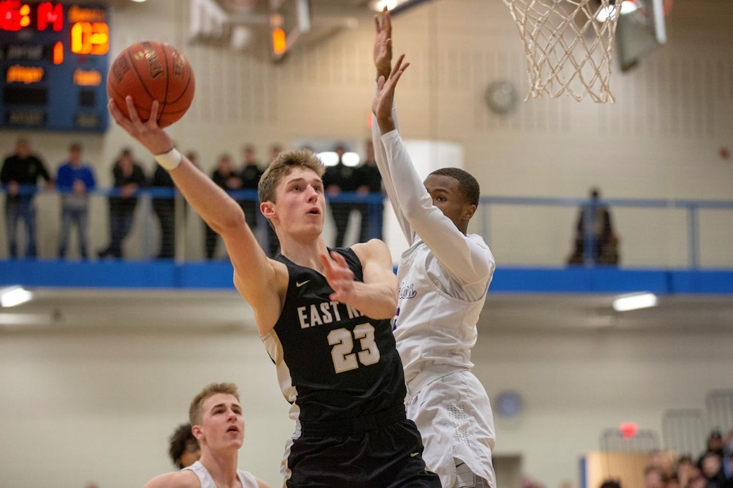 East Ridge's Ben Carlson goes up for two of his team-high 26 points against Cretin-Derham Hall Thursday night. The Raptors advanced to next week's State Tournament with a 71-45 victory over the Raiders. Photo by Jeff Lawler, SportsEngine