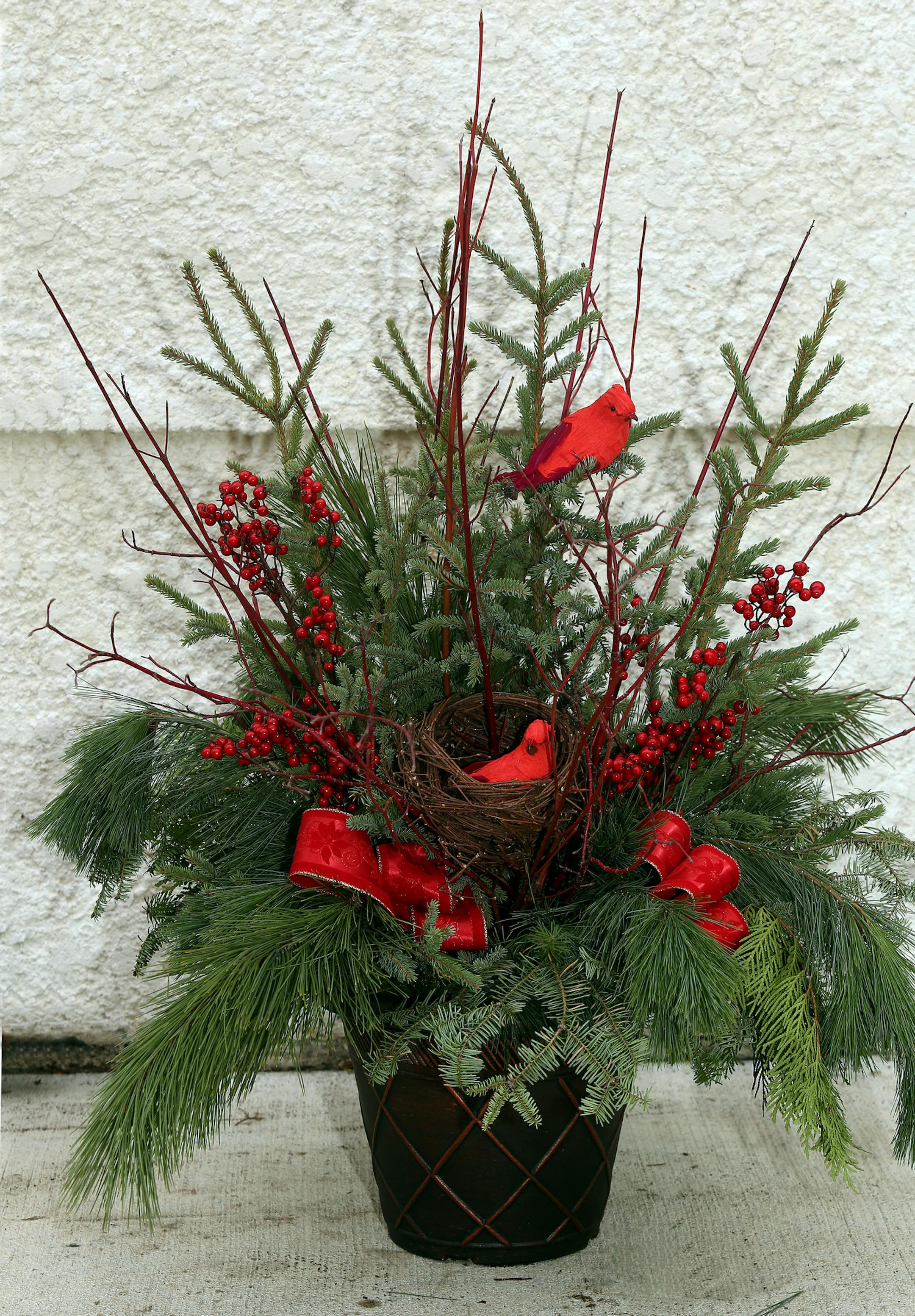 Outdoor container by Larry Pfarr in Minneapolis, MN on November 8, 2013. ] JOELKOYAMA‚Ä¢joel koyama@startribune Larry Pfarr will decorate several outdoor containers to transition from Thanksgiving thru the holidays and into the new year.