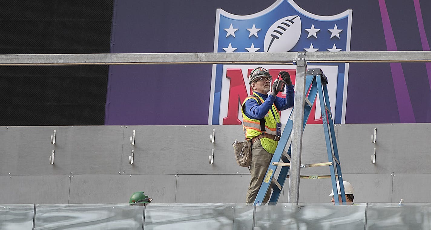 Crew worked on the field as NFL Senior Director of Events Eric Finkelstein and NFL Field Director Ed Mangan spoke to the media about field preparations for Super Bowl LII during a press conference inside US Bank Stadium, Tuesday, January 23, 2018 in Minneapolis, MN. ] ELIZABETH FLORES &#xef; liz.flores@startribune.com