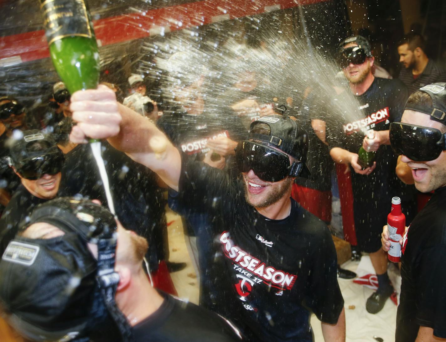 The Minnesota Twins celebrate early Thursday, Sept. 28, 2017, in Cleveland. The Twins earned an AL wild-card berth after the Los Angeles Angels lost to the Chicago White Sox. The Twins had lost 4-2 to the Cleveland Indians on Wednesday night. (AP Photo/Ron Schwane)