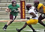 Quarterback Mitch Leidner advanced the ball on a keeper during the Gophers' spring game.
