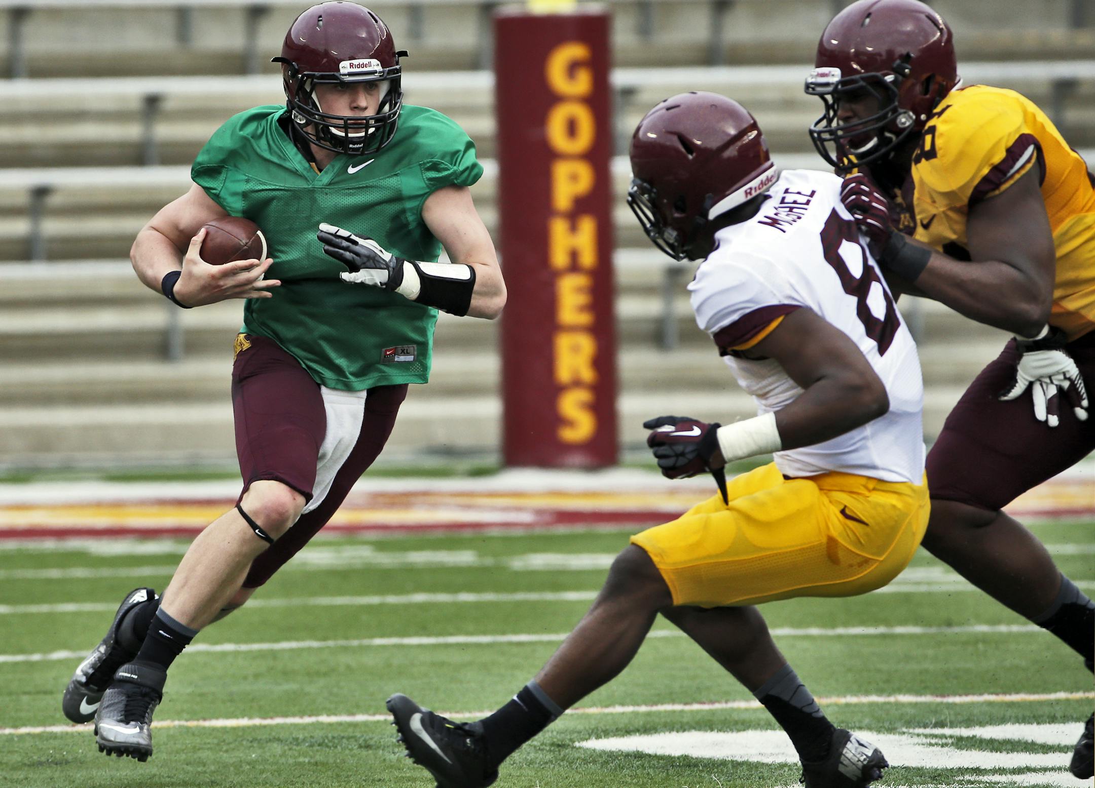 Quarterback Mitch Leidner advanced the ball on a keeper during the Gophers' spring game.