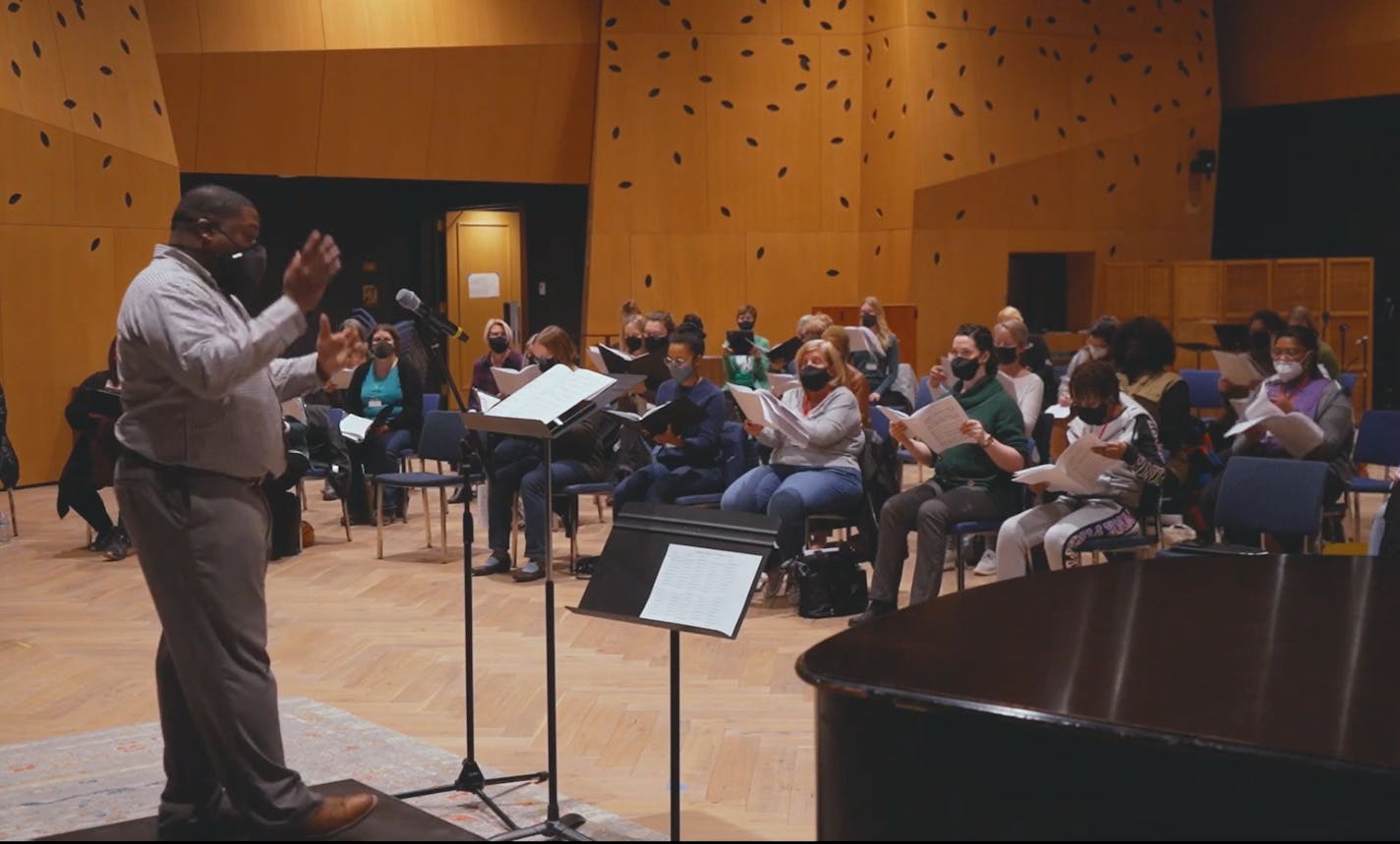 Adrian Davis, a recent University of Minnesota doctoral grad who revived Roosevelt High's music program, conducted a choral rehearsal for "Seven Last Words of the Unarmed." (Provided by Minnesota Orchestra)