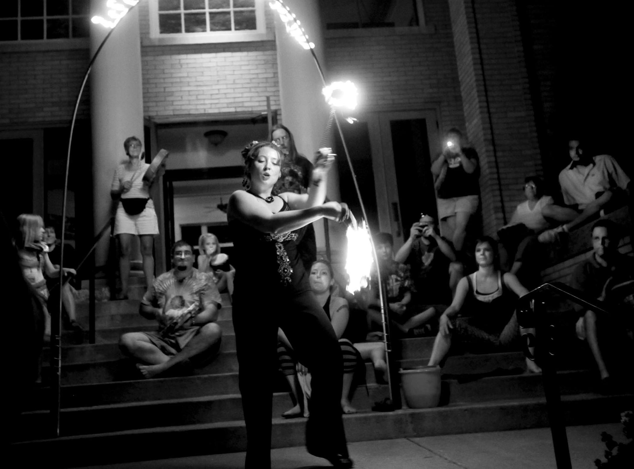 Dubbed Baptism of Fire, members of Lake Harriet Spiritual Community observed the Summer Solstice - the longest day of the year with the sun at the apex - with song, celebration, dance and fire. Participants observed the Solstice with a service honoring the divine masculine and celebrating the sun at its zenith. During the service, participants experienced a baptism by fire and then afterwards joined the "Rhythm of Love" drum circle and watched a fire dance. In this photo:] Following the service,