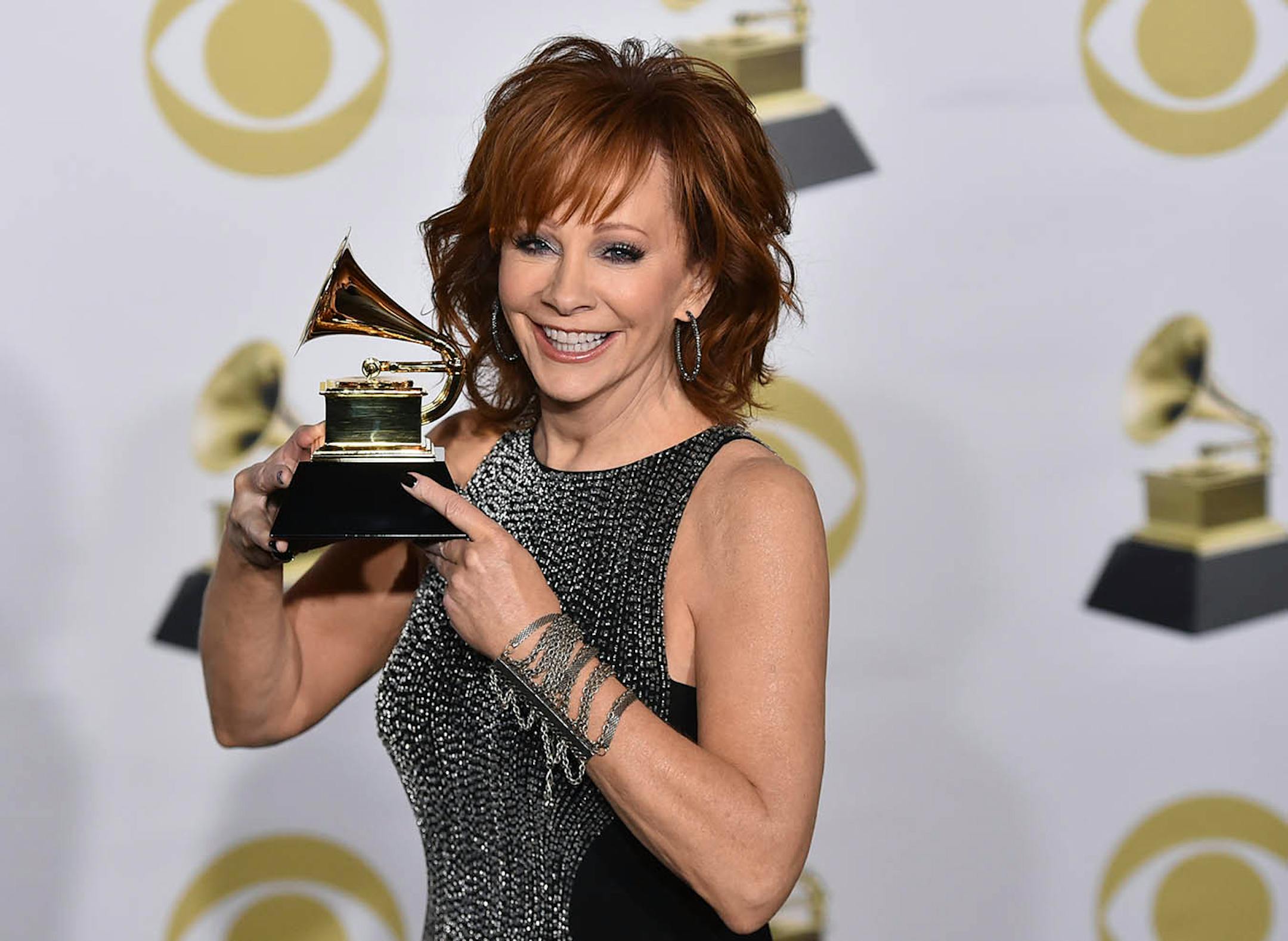 Reba McEntire poses in the press room with the best roots gospel album award for "Sing It Now: Songs Of Faith & Hope" at the 60th annual Grammy Awards at Madison Square Garden on Sunday, Jan. 28, 2018, in New York.