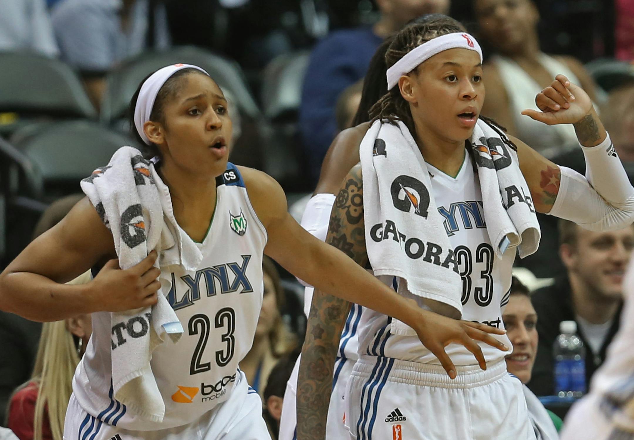Minnesota Lynx vs Seattle Storm, WNBA Playoffs, 9/20/13. (left to right) Lynx's Maya Moore and Seimone Augustus cheered on the reserves during the final minute of the game against Seattle.] Bruce Bisping/Star Tribune bbisping@startribune.com Maya Moore, Seimone Augustus/roster.