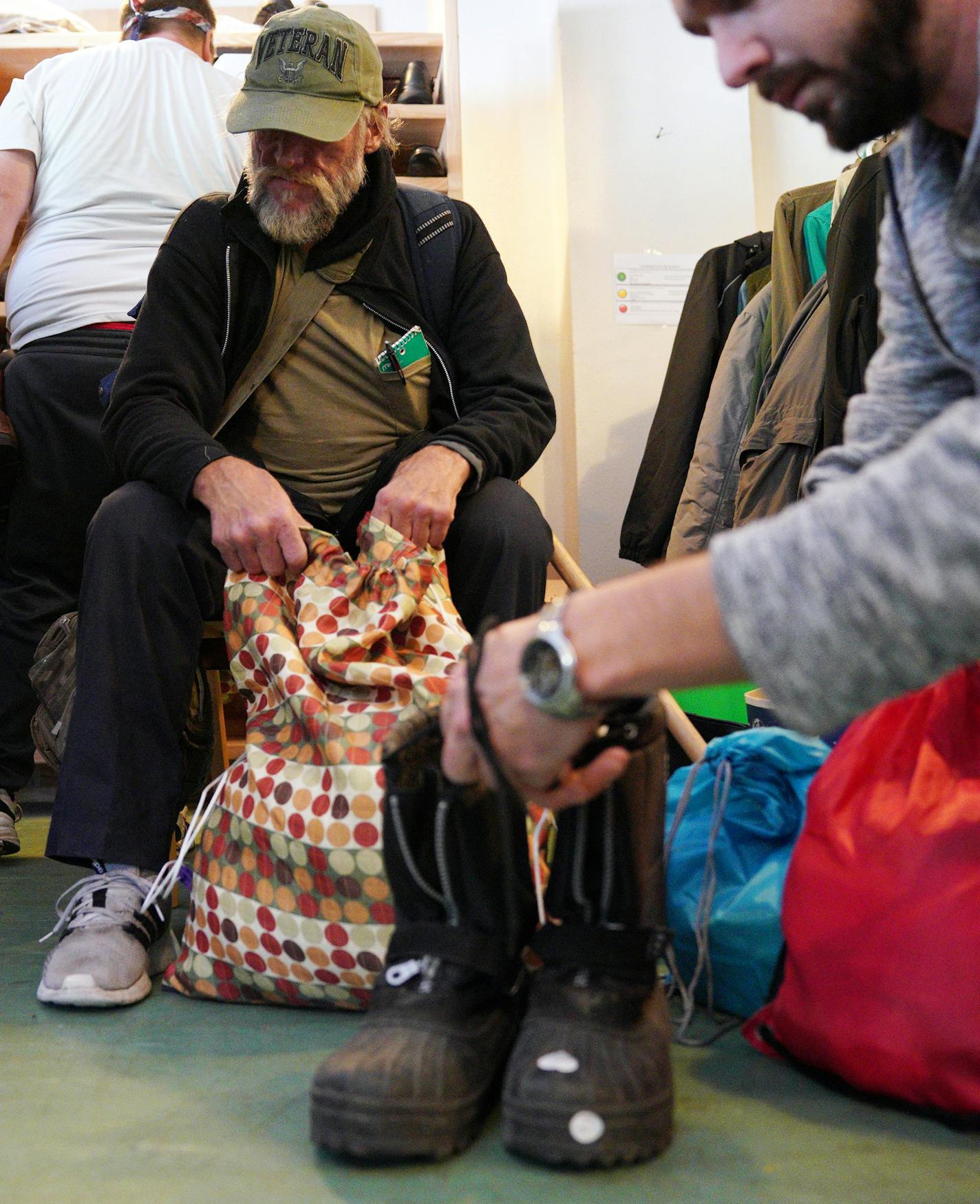 Navy Veteran James Demont got a pair of boots for the upcoming winter at Tom McKenna's organization Every Third Saturday. ] ANTHONY SOUFFLE &#x2022; anthony.souffle@startribune.com Tom McKenna, a military veteran with PTSD, welcomed fellow veterans to his organization Every Third Saturday, that gives clothes and life necessities to homeless veterans and other veterans in need, Saturday, Oct. 19, 2019 in Minneapolis.