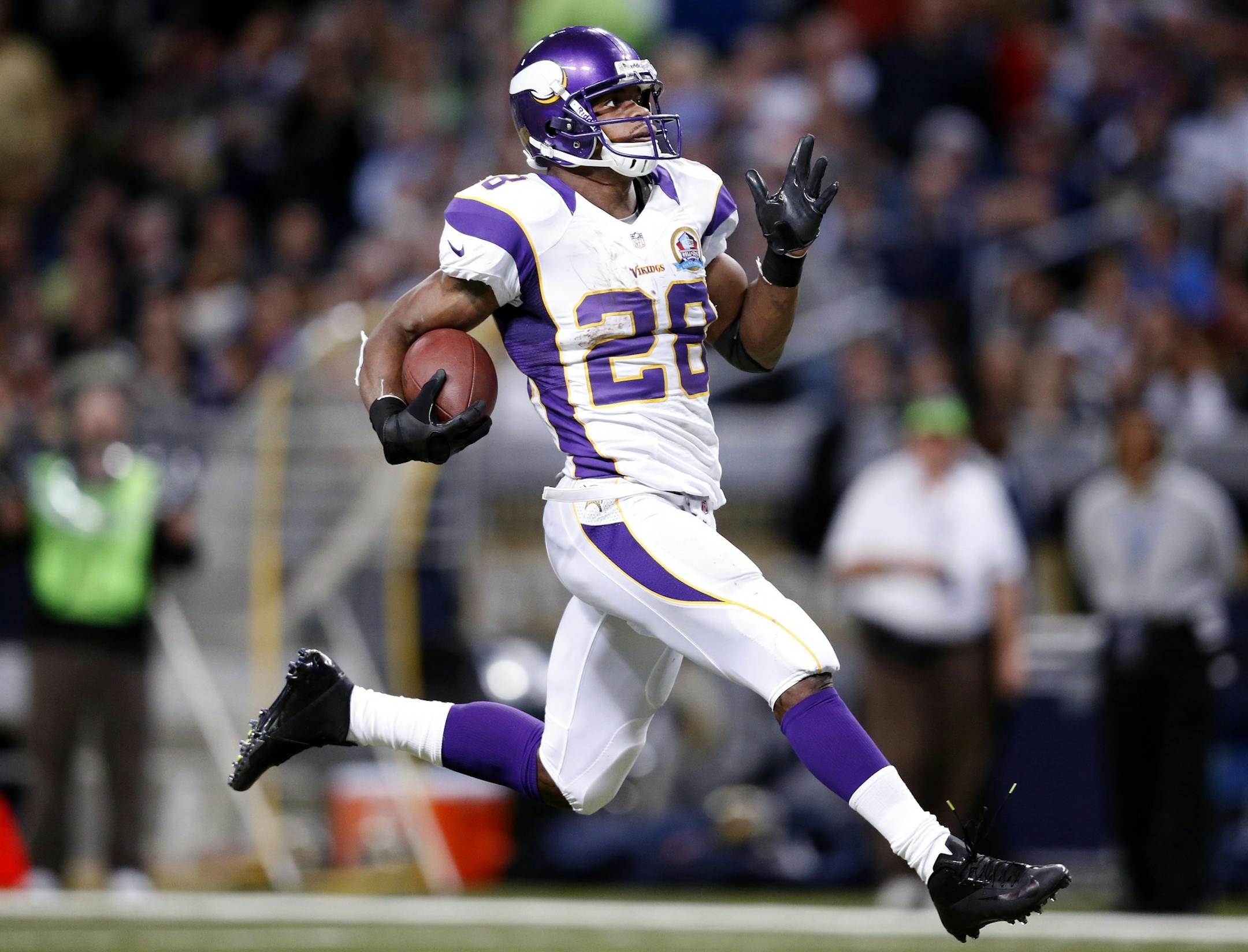 Vikings running back Adrian Peterson broke free for an 82-yard touchdown run during the second quarter Sunday against the Rams.