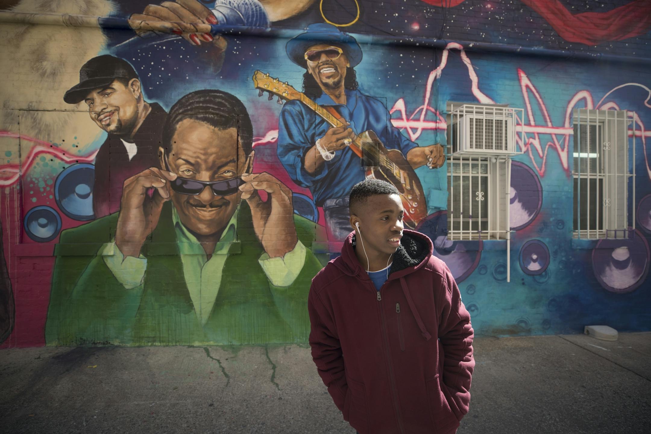 Venture Academy student Omarion Walker passed a mural in the Shaw district on Friday, March 23, 2018, in Washington, D.C.