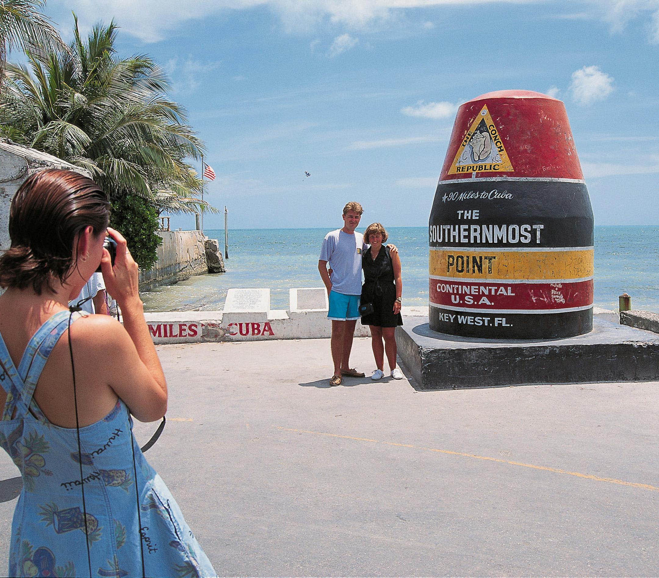 FLORIDA KEYS, KEY WEST -- Located at the corner of Whitehead and South streets, the Southernmost Point in the continental United States is marked by an oversized concrete buoy. The monument sits only 90 miles from CubaÌs coast and serves as a popular stop for visitors posing for a souvenir photo. Photo by Andy Newman/TDC.