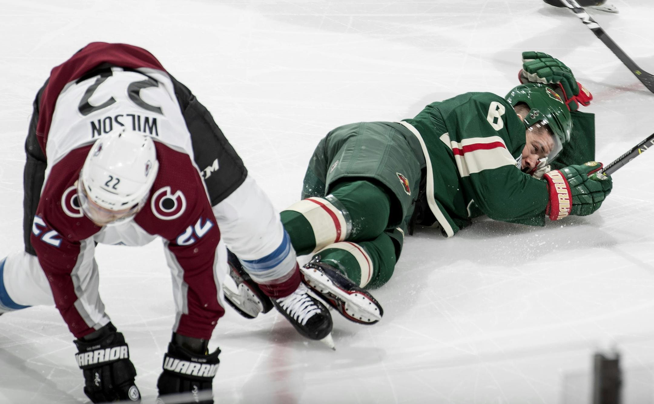 Colin Wilson (22) collided with Ryan Donato (6) in the second period.