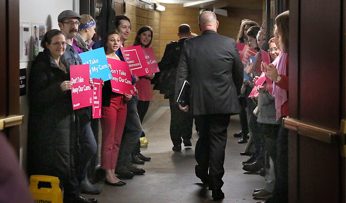 A small group of Abortion rights activists picketed at the entrance to a tunnel which leads to the State Capital and the Minnesota Senate Building]. The group had planned to protest outside, but inclement weather forced the group inside. ] james.gehrz@startribune.com /St. Paul, MN / April 28, 2016 8:30 AM - BACKGROUND INFORMATION: Abortion rights activists are staging a rally outside the Minnesota Capitol as House Republicans plan to pass a measure to end taxpayer funding of Planned Parenthood.