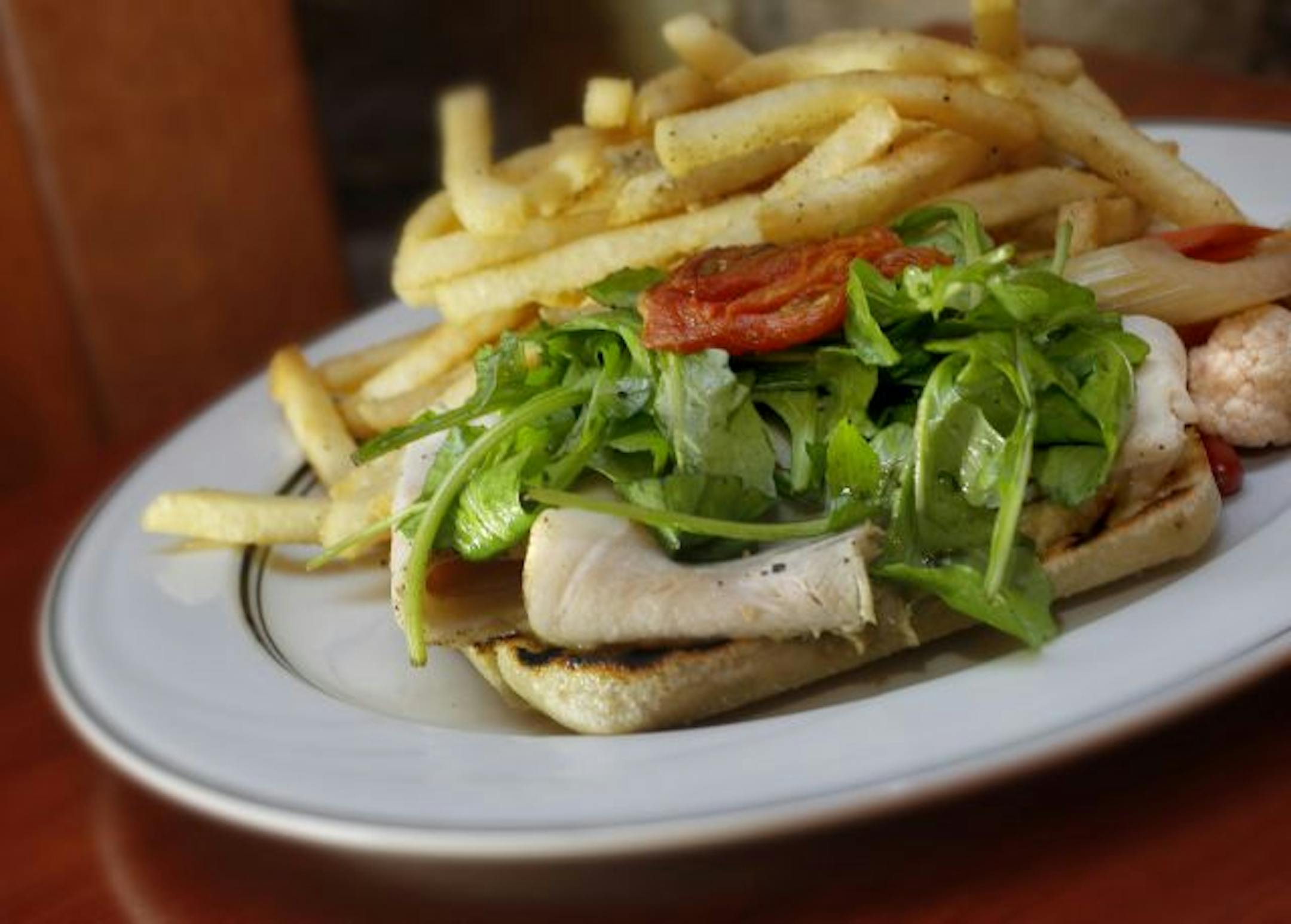 An open-faced roast pork sandwich is one of many beer-friendly items on chef Tyge Nelson's menu.