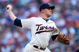 Minnesota Twins starting pitcher Tyler Duffey (56) threw a pitch against Cleveland in the top of the first inning.