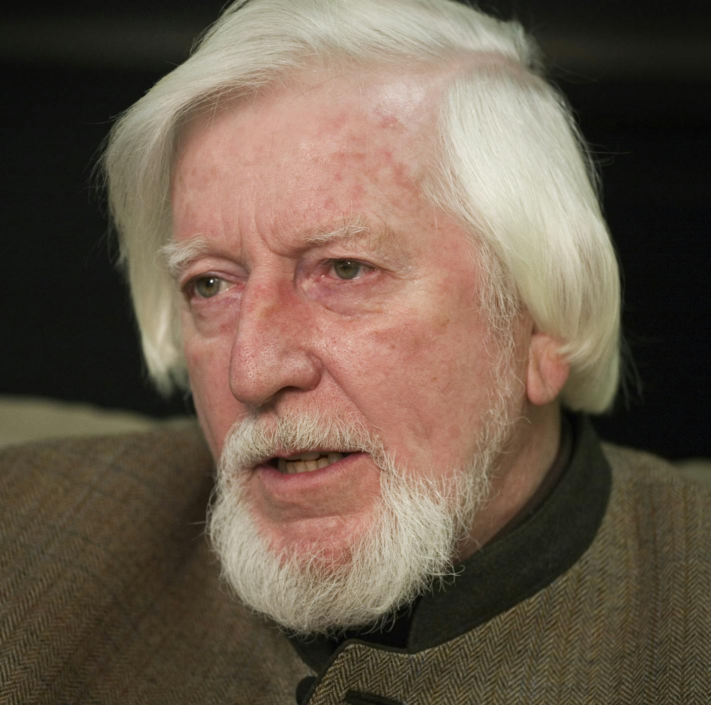 FILE - In this April 10, 2008 file photo, puppeteer Caroll Spinney, who voices Big Bird and Oscar the Grouch, is interviewed during a break from taping an episode of Sesame Street in New York. Spinney drops his fine-feathered obscurity (and emerges from his garbage-can fortress as Oscar the Grouch) for an enchanting film portrait, "I Am Big Bird: The Caroll Spinney Story," which celebrates the "Sesame Street" puppet master who, at age 81, continues to breathe life into a pair of the world's best