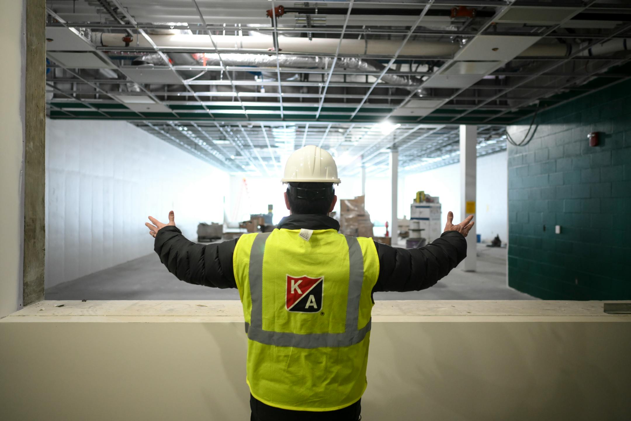Willie Spelts, Rock Ridge fundraising coordinator and director of school to work engagement, tours the new school and discusses the facilities Tuesday, Feb. 22, 2022. Spelts is the former athletic director at Virginia High School and former elementary school principal.