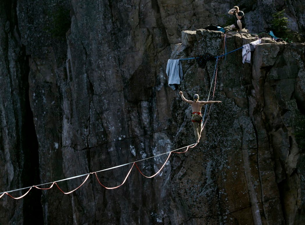 Slackliner Michael Nichols on a 580-foot-long line between the cliffs.