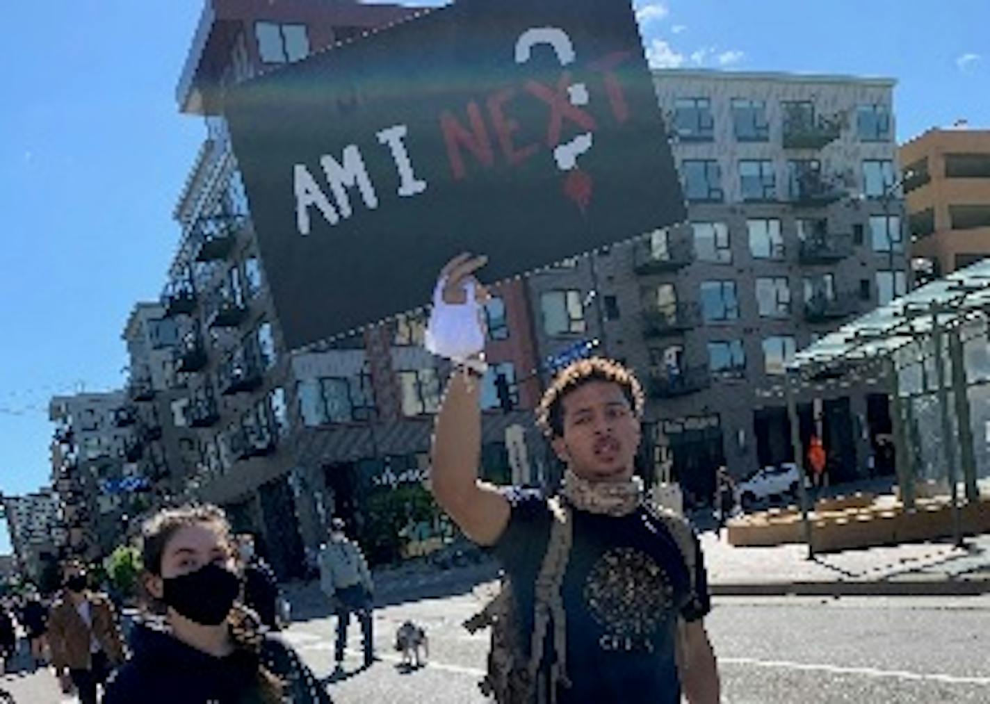 T.K. Marshall, a recently graduated senior and a star on Minneapolis Southwest's football team last fall, carried a sign in a recent protest in Minneapolis.